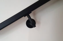 Load image into Gallery viewer, Modern handrail bracket, Black color. attached to a custom black metal railing.
