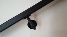 Load image into Gallery viewer, Modern handrail bracket, Black color. attached to a custom black metal railing.
