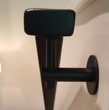 Load image into Gallery viewer, Modern handrail bracket, Black color. with custom black metal railing attached. 
