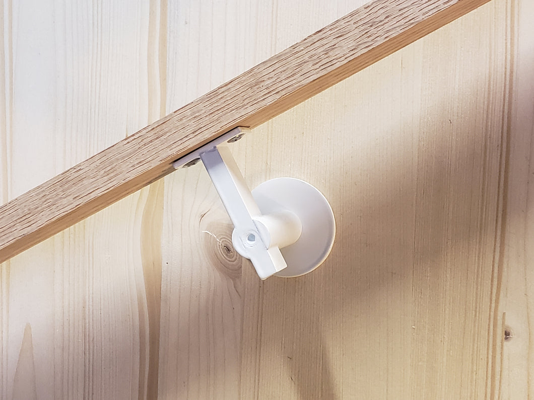 Modern handrail bracket. Bone white attached to a custom wooden railing. 