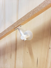 Load image into Gallery viewer, Modern handrail bracket. Bone white attached to a custom wooden railing.
