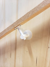 Load image into Gallery viewer, Modern handrail bracket, white color. attached to a custom wooden railing.
