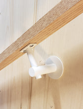 Load image into Gallery viewer, Modern handrail bracket, white color. attached to a custom wooden railing.
