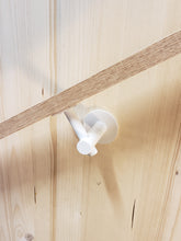 Load image into Gallery viewer, Modern handrail bracket, white color. attached to a custom wooden railing.
